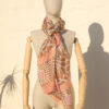 A very soft an elegant shawl in beige color with pink details.
A very soft an elegant shawl in beige color with pink details.