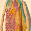 A very soft an elegant shawl in yellow color with multicolor details.