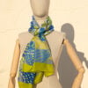 A very soft an elegant shawl in blue color with yellow details.