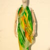 A very soft an elegant shawl in green color with multicolor details.