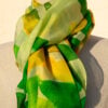 A very soft an elegant shawl in green color with multicolor details.