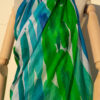 A very soft an elegant shawl in blue color with multicolor details.