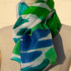 A very soft an elegant shawl in blue color with multicolor details.