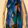 A very soft an elegant shawl in blue color with multicolor details.