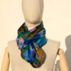 A very soft an elegant shawl in blue color with multicolor details.