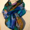 A very soft an elegant shawl in blue color with multicolor details.