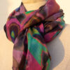 A very soft an elegant shawl in purple color with multicolor details.