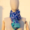 A very soft an elegant shawl in blue color with white and turquoise details.