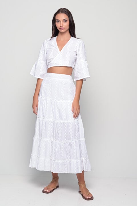 Model wearing long white cotton frill skirt with embroidery