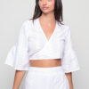 Women’s white embroidered cotton tie top with wrap V-neck, flared sleeves, and cropped design – summer boho blouse.