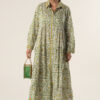 Model wearing Ikaria long cotton dress in daisy green block print with yellow details