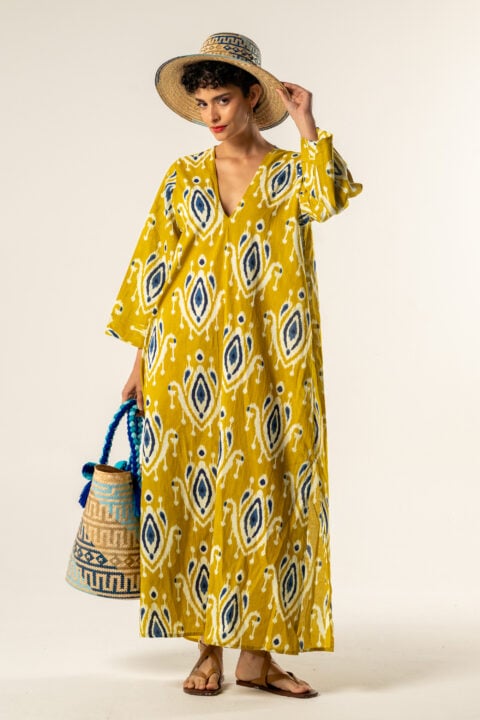 Model wearing Morocco Caftan in mustard Ikat cotton print with wide sleeves and V-neck