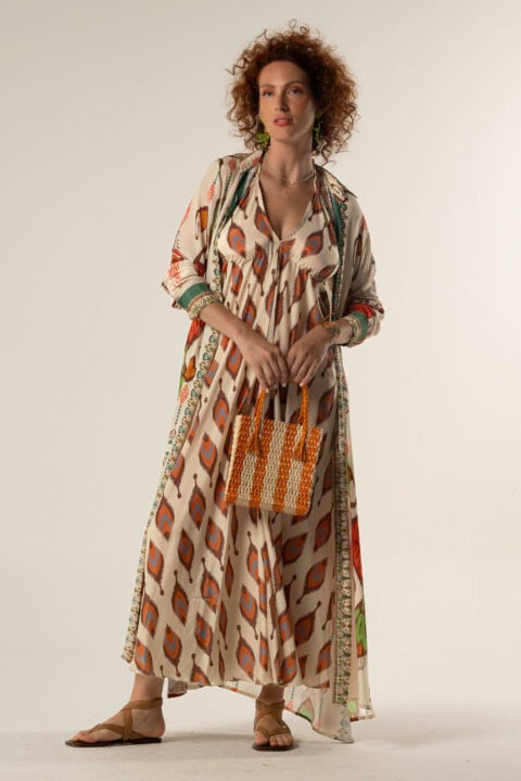 Model wearing open back long dress in Flame Beige digital print saree silk with tie detail and V-neckline