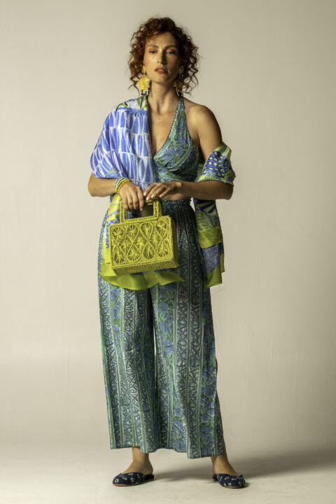 Model wearing Anna Trousers and Ios Top in green striped cotton