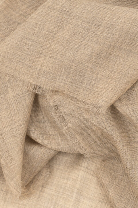 Light beige 100% cashmere pashmina with airy weave and fringed edges