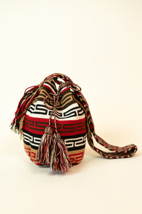 Handmade Wayuu bag – red, brown, black and white woven shoulder bag with tassels crafted by Wayuu artisans in Colombia