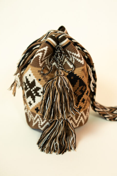 Handmade Wayuu bag with tribal geometric design – brown and beige woven shoulder bag with tassels crafted by Wayuu artisans in Colombia