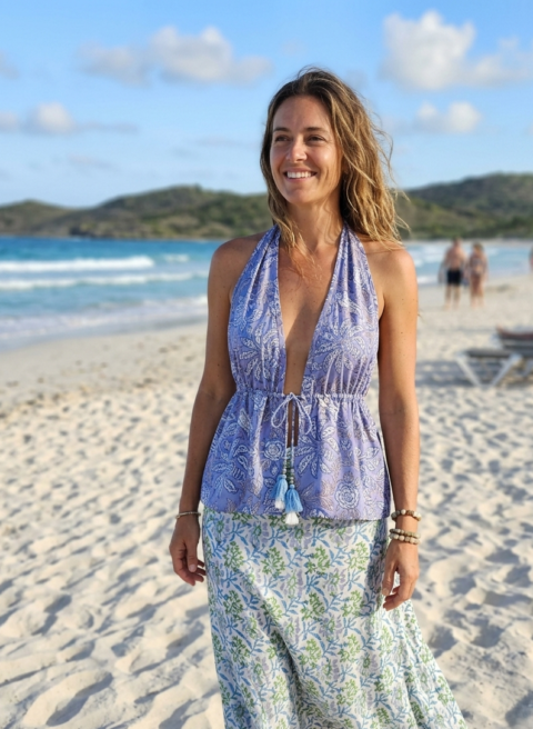 Front and back view of the Malia blue and white floral cotton halter top with tassels on a mannequin.