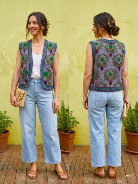 Front and back view of a woman wearing a grey cotton vest with colorful Suzani floral embroidery.