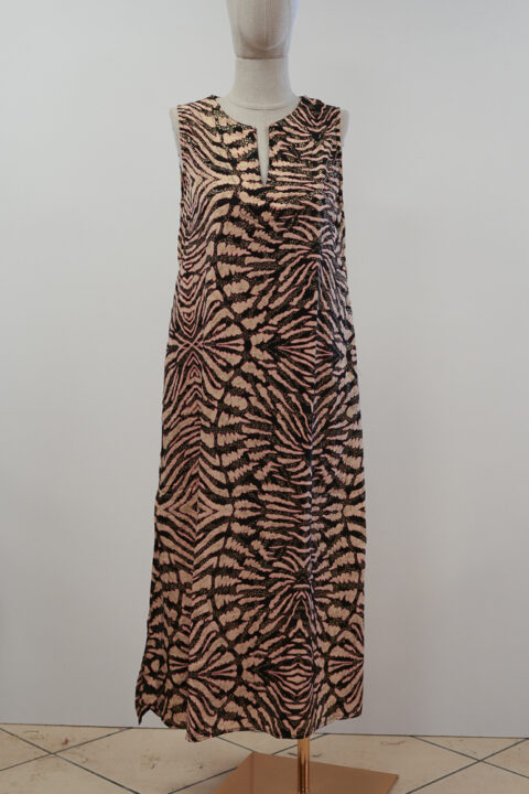 Long saree silk dress with animal print and relaxed silhouette displayed on mannequin.